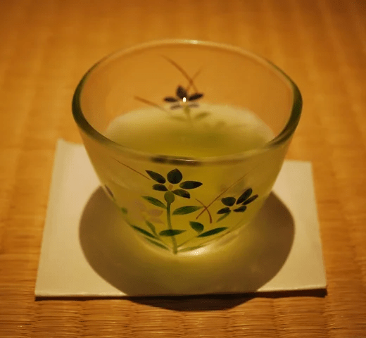 Umami-rich Japanese tea was served in a glass teacup.